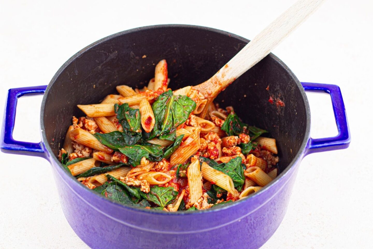 turkey pasta in pan with spinach