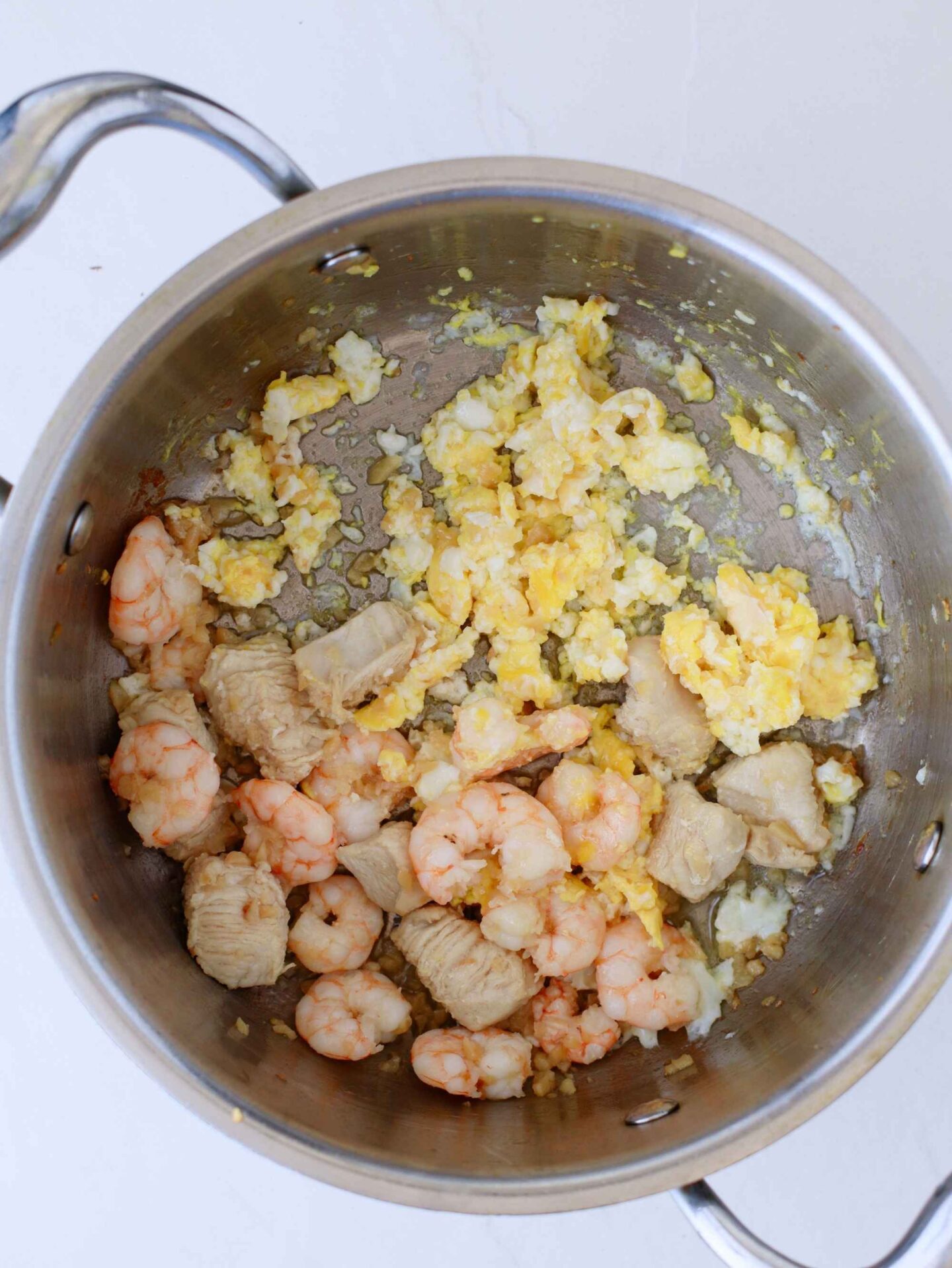chicken shrimp and egg in pan