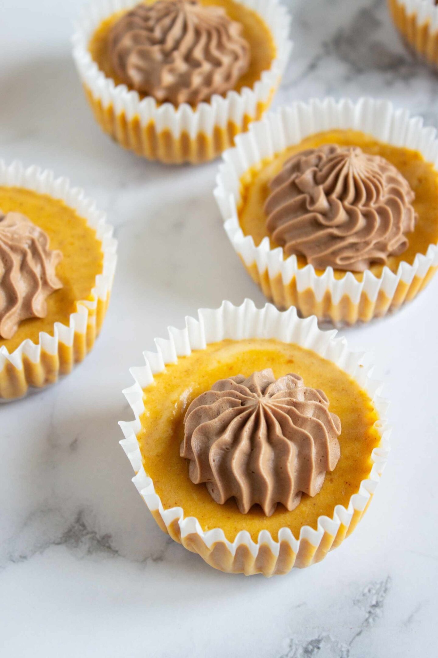 ganache on mini cheesecakes