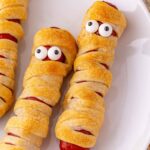 hot dog mummies on plate