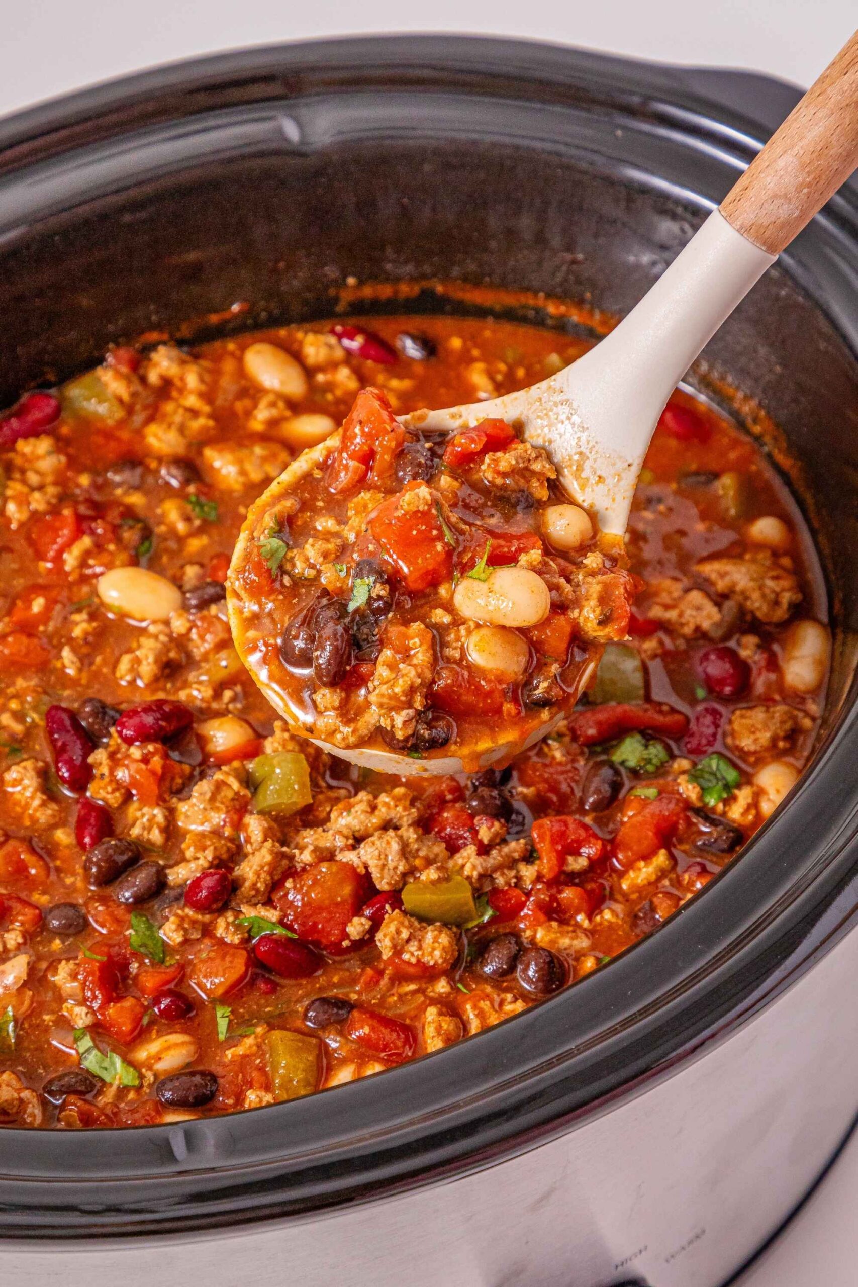 crockpot turkey chili on spoon