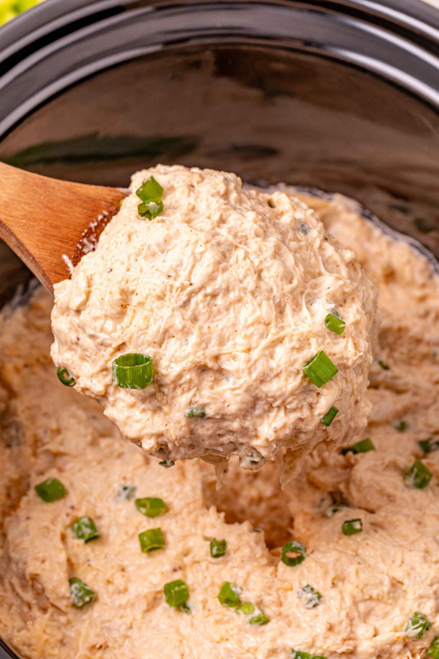 crockpot crab dip on spoon