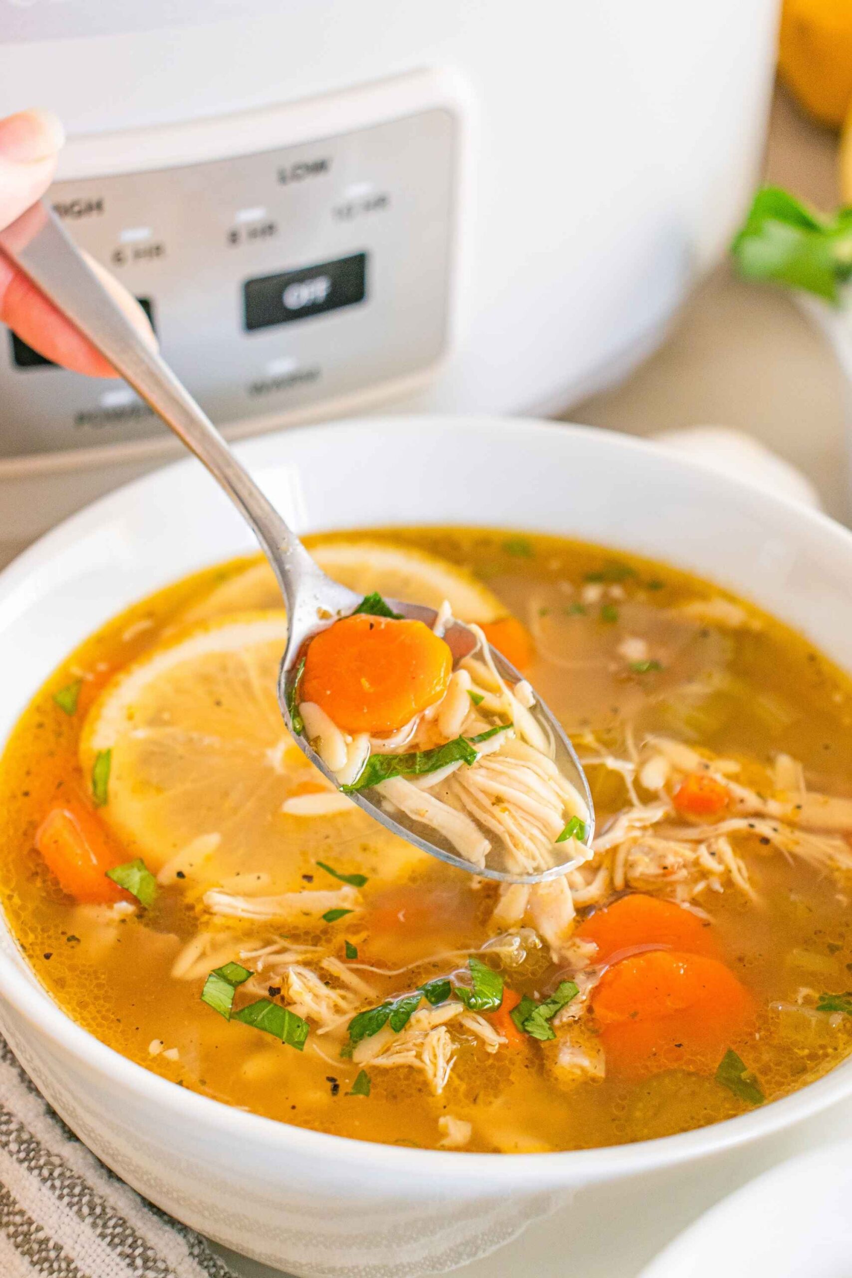 crockpot lemon chicken soup in bowl
