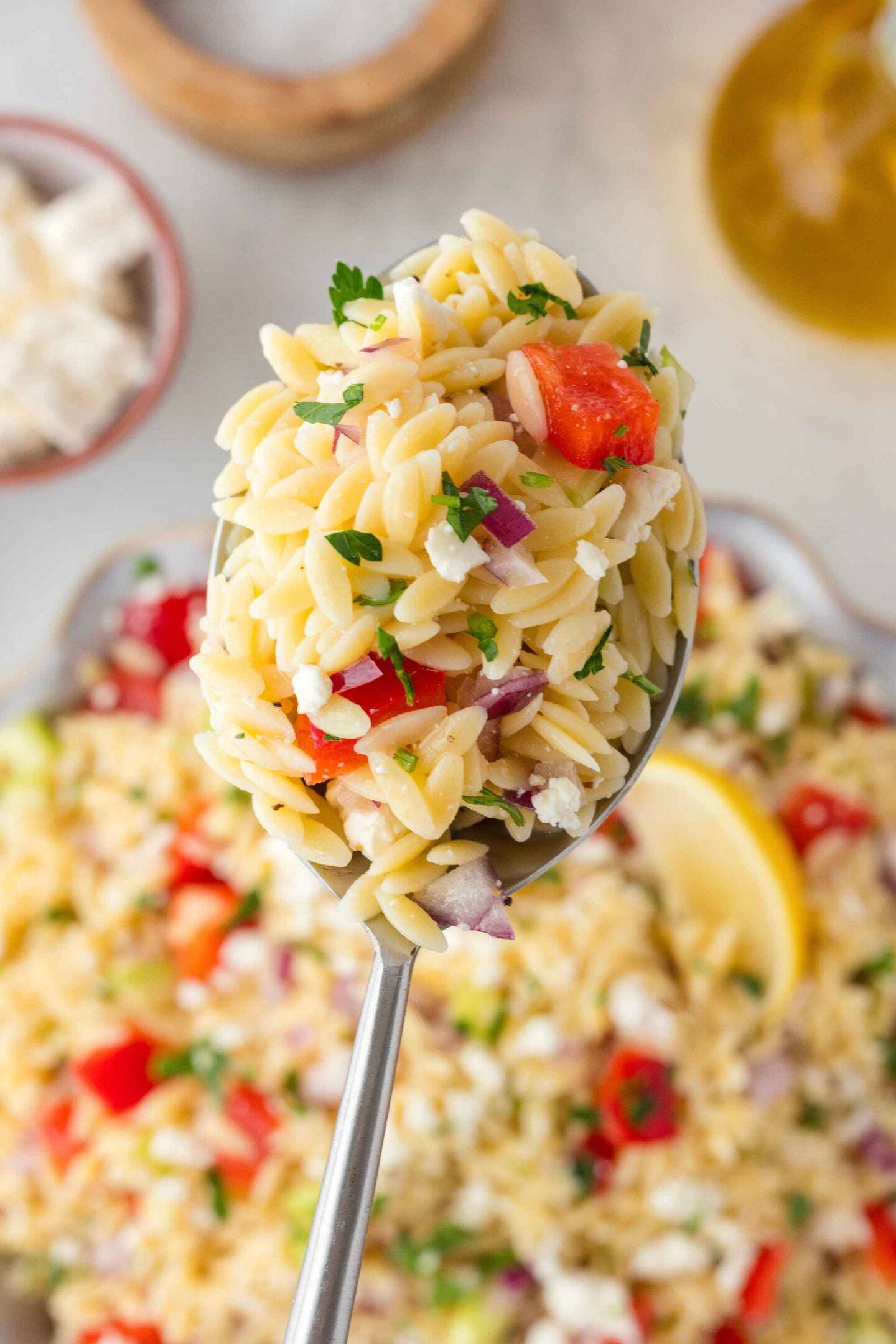 orzo salad on spoon