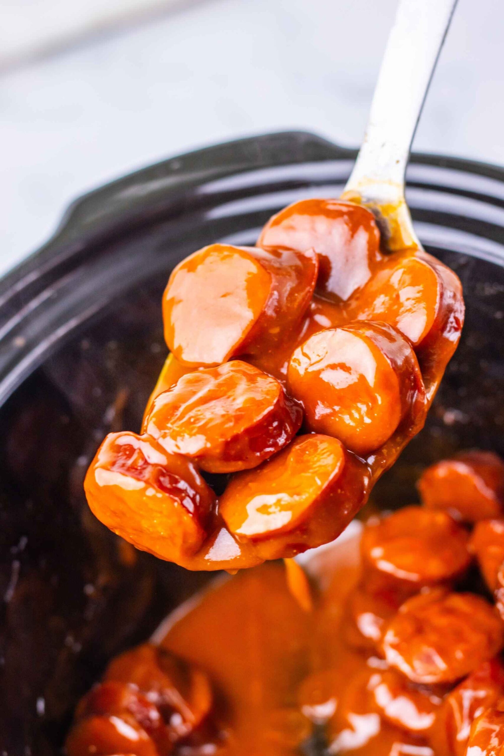 kielbasa bites on spoon